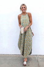 Woman wearing a floral dress with a white background and '100% Rayon' text.