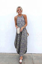 Woman wearing a floral dress against a white wall